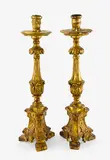 Spanish 19th century, A good pair of giltwood ecclesiastical altar candlesticks.