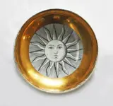 decorated with a sun burst design by 1950’s Piero Fornasetti dish, sold Oct 2012
