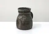 Warren Tippett, Stoneware tankard with brown and grey glaze, impressed leaf design to the body, impressed mark.
