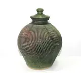 Warren Tippett, Stoneware green glazed lidded storage jar