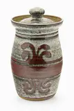 Jim Greig, Stoneware lidded jar with wax resist pattern in tenmoku glaze over an iron and ash glaze.