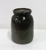Barry Brickell, Lidded stoneware biscuit barrel with blue-green glaze and recessed lid. Cipher mark to base.