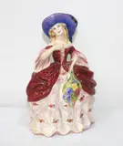 Sherwood Pottery, hand painted pottery figure of a lady wearing blue bonnet