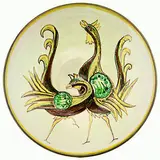 Elizabeth Lissaman, Rare art pottery dish, hand painted with dancing peacocks. The foot ring pieced for wall suspension.