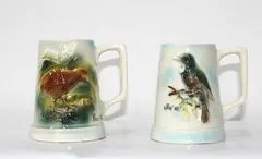 Cameron Brown, two mugs Tui and Kiwi