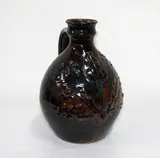 Jeff Scholes, Stoneware flagon, tenmoku and Chun-type glaze. Initials to base.