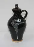 Janet Wright, Stoneware jug with Chinese-inspired Jun and tenmoku glaze, complete with original stopper. Cipher to base of handle.