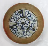 Marilyn Wiseman, Stoneware bowl with unglazed exterior and outside rim. The well with gestural floral decoration on a pale celadon ground.