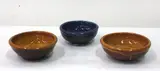 Richard Parker, Three small stoneware bowls, two yellow glazed, one blue glazed. Unmarked (3)
