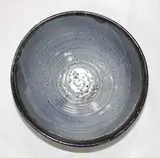 Jeff Scholes, Stoneware bowl with blue-glazed interior and Tenmoku exterior.