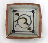 Marilyn Wiseman, Stoneware square-form platter on four feet with poured brown and blue gestural decoration to the well.