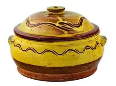 A large slipware casserole dish by Winchcombe Pottery, sold Jun 2011