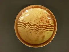 Winchcombe pottery slipware dish by Michael Cardew, sold Jun 2011