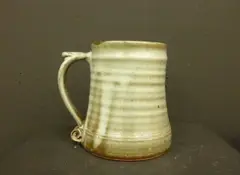 Four stoneware mugs by St Ives, sold Jun 2011