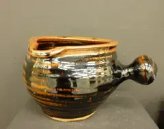 Tenmoku glazed pouring bowl, two small bowls and four small plates by Wilfred Wright, sold Jun 2011