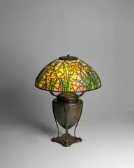 Tiffany Studios, Daffodil Table Lamp, on Classical Base, leaded glass and patinated bronze, shade stamped 'TIFFANY STUDIOS NEW YORK', base stamped 'TIFFANY STUDIOS NEW YORK'