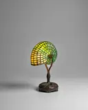 Rare Nautilus Lamp by Tiffany Studios, leaded glass and patinated bronze, base stamped 'TIFFANY STUDIOS NEW YORK 21545', sold Dec 2022