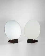 Pair of Table Mirrors by Émile-Jacques Ruhlmann, glass and macassar ebony, each branded 'Ruhlmann', one stamped 'A', sold Dec 2022
