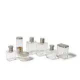 French Art Deco, Associated Seven Piece Vanity Set, comprising four scent bottles and three covered jars, glass, silver and vermeil, five pieces monogrammed 'GD'