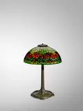 'Poinsetta' Table Lamp by Tiffany Studios, leaded glass, patinated bronze, shade stamped 'TIFFANY STUDIOS NEW YORK 1558', base stamped 'TIFFANY STUDIOS NEW YORK 53, sold Jun 2022