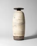Important tall bottle vase with disc by Hans Coper, circa 1968, sold Oct 2022