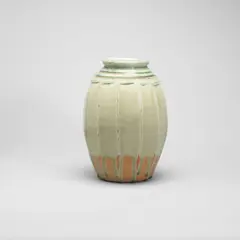 Untitled by Richard Batterham, Stoneware, pale green ash glaze over a cut-sided body, darker blue green glaze over incised spiral around the shoulder, sold Oct 2022