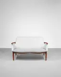 Two-seater sofa, model no. FJ 53 by Finn Juhl, circa 1953, Teak, brass, fabric upholstery, offered Oct 2022