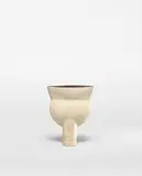 'Thistle' form by Hans Coper, circa 1965, Stoneware, layered porcelain slips and engobes over a textured and incised body, the interior with a manganese glaze, sold Apr 2022