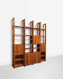 Luigi Zuccoli, Unique bookcase, designed for the 'San Fermo' building, Como, circa 1954, Walnut, walnut-veneered wood, plastic-laminated wood, sapele, brass