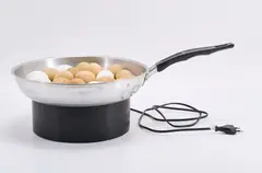 Pol Bury, Bratpfanne mit Eiern, 1972, Kinetisches Objekt. Bratpfanne, ausgeblasene Eier, mit Magneten und Motor versehen, elektrifiziert
