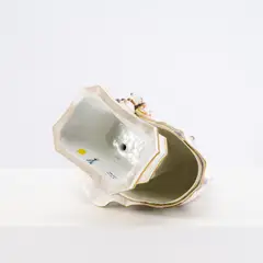 Reifrockdame mit Mopshunden by Meissen, Porzellan, polychrom und gold staffiert., sold May 2026