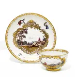 Meissen, Teetasse und Unterschale mit Landschaftskartuschen, Porzellan, farbig und gold dekoriert