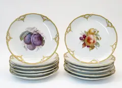 Zwölf Teller mit Obstdekor by Kpm, Porzellan, farbig und gold staffiert, sold May 2014