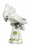 Kakadu auf Baumstamm by Meissen, Porzellan, farbig und gold staffiert, sold May 2015