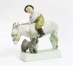 Junge auf Esel by Zsolnay, Porzellan, farbiges Dekor, sold Jan 2016