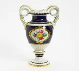 Schlangenhenkelvase mit Blumenbouquet by Meissen, Porzellan, farbig und gold staffiert, sold Jan 2016
