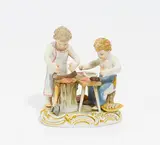 Amoretten Wurst Machend by Meissen, Vor 1924, Porzellan, farbig und gold staffiert, sold Jan 2017