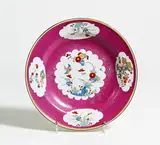 Teller mit Kakiemonkartuschen auf Purpur Fond by Meissen, Um 1740, Porzellan, farbig dekoriert, braune und goldene Randlinie, sold Nov 2020
