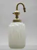 Atomizer by Lalique, Opalescent glass with ten molded nudes, sold May 2002