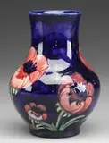 Moorcroft, Decorated Vase, The dark blue glaze extends into the interior of the vase
