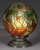 Fire Ball Lamp by Tiffany Studios, The shade rests atop a bronze saucer base with single socket, sold Nov 2008