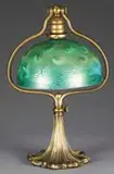 Desk Lamp by Tiffany Studios, Lamp begins with a large adjustable bronze ornate base with a gold dore finish, sold Nov 2008