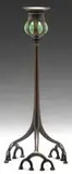 Blown Glass Candlestick by Tiffany Studios, Open-root patinated candlestick supports a green blown glass top, sold Jun 2010