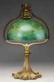 Desk Lamp by Tiffany Studios, Lamp begins with a large adjustable bronze ornate base with a gold dore finish, sold Jun 2008