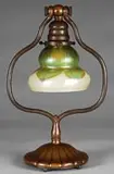 Desk Lamp by Tiffany Studios, This desk lamp begins with a bronze harp style base with a fluted pedestal foot, sold Jun 2008