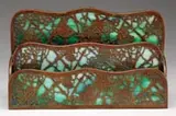 Grapevine Paper Rack by Tiffany Studios, Etched metal in grapevine pattern with green striated glass backing, sold Jun 2007