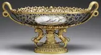 Center Bowl with Lion and Serpent Mounts by Sèvres, Edges of bowl mounted with gilt brass scrollwork, sold Feb 2012