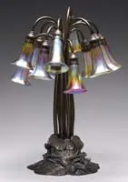 12 Lite Lily Lamp by Tiffany Studios, Lamp begins with a bronze base that carries a desirable statuary bronze finish, sold Jun 2009