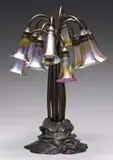 12 Lite Lily Lamp by Tiffany Studios, Lamp begins with a bronze base that carries a desirable statuary bronze finish, sold Jun 2009