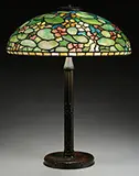 Nasturtium Table Lamp by Tiffany Studios, Shade rests on a Tiffany Studios American Indian bronze base, sold Nov 2015